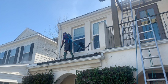 Pressure washing a roof in Orange County