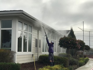 Pressure washing a roof